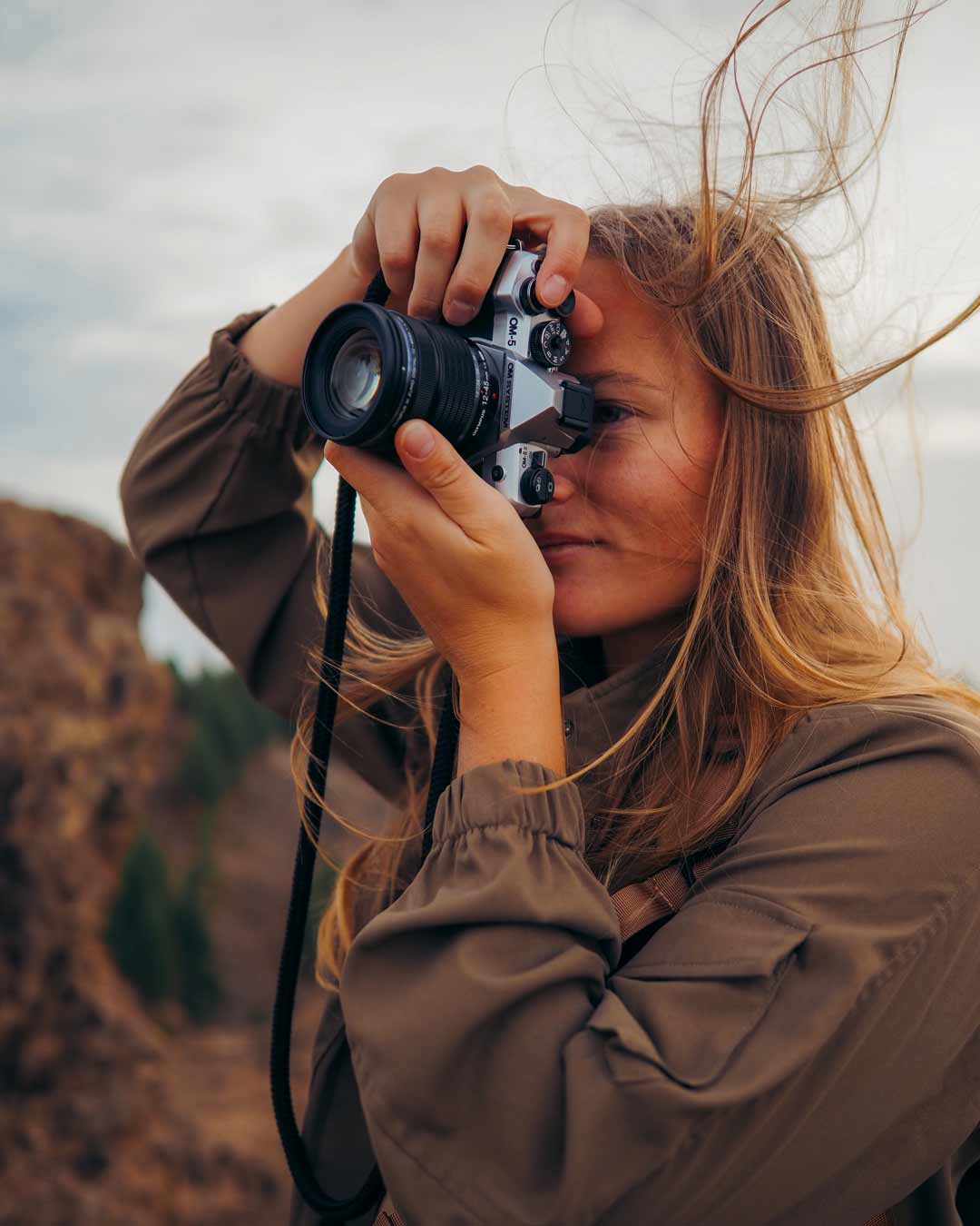 OM System OM-5 Mark II in the field. Photo by Chris Poplawski